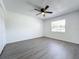 Simple bedroom with grey vinyl flooring and ceiling fan at 767 Trailwood Dr, Altamonte Springs, FL 32714