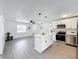 Modern kitchen with white cabinets and island at 767 Trailwood Dr, Altamonte Springs, FL 32714