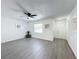 Spacious living room with gray vinyl flooring and ceiling fan at 767 Trailwood Dr, Altamonte Springs, FL 32714