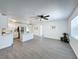 Bright living room with grey vinyl flooring and ceiling fan at 767 Trailwood Dr, Altamonte Springs, FL 32714