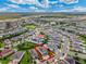 Aerial view of a residential neighborhood showing a house and community amenities at 7723 Graben St, Kissimmee, FL 34747