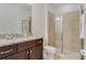 Bathroom with granite countertop and walk-in shower at 7723 Graben St, Kissimmee, FL 34747