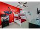 Fun bedroom with a Spiderman mural and a bunk bed at 7723 Graben St, Kissimmee, FL 34747