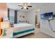 Bright bedroom with en-suite bathroom and ceiling fan at 7723 Graben St, Kissimmee, FL 34747