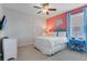 Bright bedroom with a queen-size bed, TV, and en-suite bathroom at 7723 Graben St, Kissimmee, FL 34747