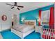 Bedroom with king-size bed, crib, and ensuite bathroom at 7723 Graben St, Kissimmee, FL 34747