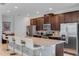 Modern kitchen featuring dark wood cabinets and granite island at 7723 Graben St, Kissimmee, FL 34747