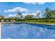 Sparkling pool surrounded by lush landscaping at 7723 Graben St, Kissimmee, FL 34747