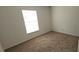 Empty bedroom featuring a window and carpet at 7808 Rollingridge Ct, Orlando, FL 32835