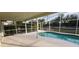 Screened pool area with concrete decking at 7808 Rollingridge Ct, Orlando, FL 32835