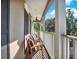 Relaxing balcony with two chairs and white railings at 833 Ellwood Ave, Orlando, FL 32804