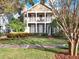 Two story house with a front porch and green lawn at 833 Ellwood Ave, Orlando, FL 32804