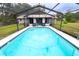 Inviting screened pool with tiled deck at 883 Montrose Ave, Orange City, FL 32763