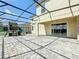Spacious screened patio with a play area and sliding glass doors at 8886 Fallen Oak Dr, Davenport, FL 33896