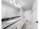 Bathroom featuring double sinks, a shower, and a toilet at 8886 Fallen Oak Dr, Davenport, FL 33896