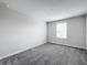 Bedroom with a window and neutral colored carpet at 8886 Fallen Oak Dr, Davenport, FL 33896