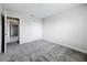 Bright bedroom with double door closet and grey carpet at 8886 Fallen Oak Dr, Davenport, FL 33896