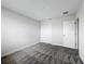 Clean, well-lit bedroom with carpet, closet, and neutral paint scheme at 8886 Fallen Oak Dr, Davenport, FL 33896