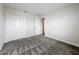 Bedroom with carpet, closet, and a doorway leading to another room at 8886 Fallen Oak Dr, Davenport, FL 33896