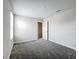 The bedroom offers carpeted floors, neutral walls, and a window for natural light at 8886 Fallen Oak Dr, Davenport, FL 33896