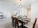 Formal dining room with chandelier and hardwood floors at 8886 Fallen Oak Dr, Davenport, FL 33896