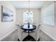 Dining room features a modern chandelier and contemporary artwork at 8886 Fallen Oak Dr, Davenport, FL 33896