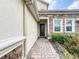 The home's facade combines stone and stucco accents, featuring a front door and manicured landscaping at 8886 Fallen Oak Dr, Davenport, FL 33896