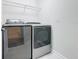 The laundry room features updated appliances and ample space at 8886 Fallen Oak Dr, Davenport, FL 33896