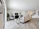 Bright living room boasts modern design, comfortable seating, and an open staircase, creating a welcoming space at 8886 Fallen Oak Dr, Davenport, FL 33896