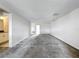 Expansive living room with gray carpet and adjoining rooms visible at 8886 Fallen Oak Dr, Davenport, FL 33896