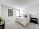 Calm main bedroom featuring soft bedding, carpet flooring, matching lamps and decorative pillows at 8886 Fallen Oak Dr, Davenport, FL 33896