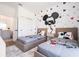 Mickey Mouse themed bedroom with two twin beds at 9029 Ibiza Ln # 1, Kissimmee, FL 34747