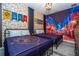 Themed bedroom with two twin beds and a mural at 9029 Ibiza Ln # 1, Kissimmee, FL 34747