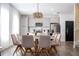 Modern dining room with eight chairs and kitchen view at 9029 Ibiza Ln # 1, Kissimmee, FL 34747