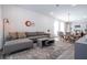 Living room with gray sectional sofa and a modern coffee table at 9029 Ibiza Ln # 1, Kissimmee, FL 34747