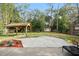 Large backyard with patio, shed, and mature trees at 905 Suwannee Dr, Apopka, FL 32703