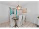 Bright dining room with glass table and white chairs at 905 Suwannee Dr, Apopka, FL 32703