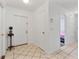 Bright entryway with tile flooring, closet, and view into other rooms at 905 Suwannee Dr, Apopka, FL 32703