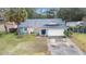 Single story home with attached garage and landscaped yard at 905 Suwannee Dr, Apopka, FL 32703