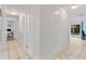 Clean hallway with tile floors and doors leading to other rooms at 905 Suwannee Dr, Apopka, FL 32703