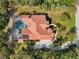 Overhead view of house, pool, and surrounding landscape at 10 Broadwater Dr, Ormond Beach, FL 32174