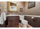 Small bathroom with dark wood vanity and tiled floor at 10 Broadwater Dr, Ormond Beach, FL 32174