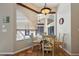 Bright breakfast nook with table and chairs, overlooking the backyard at 10 Broadwater Dr, Ormond Beach, FL 32174