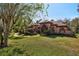 Exterior of a beautiful, one-story home with a tile roof and stone accents at 10 Broadwater Dr, Ormond Beach, FL 32174