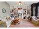 Cozy living room featuring built-in bookshelves and hardwood floors at 10 Broadwater Dr, Ormond Beach, FL 32174