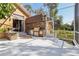 Outdoor kitchen with built-in grill and stone accents at 10 Broadwater Dr, Ormond Beach, FL 32174