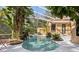 Inviting pool area with lush tropical landscaping at 10 Broadwater Dr, Ormond Beach, FL 32174