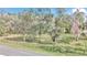 Secluded lot with mature trees and a black fence at 11431 Nw 100Th St, Ocala, FL 34482