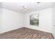 Well lit bedroom with wood-look floors and window at 11431 Nw 100Th St, Ocala, FL 34482