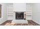 White brick fireplace with built-in shelving at 11431 Nw 100Th St, Ocala, FL 34482